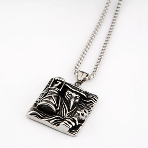 Detailed macro view of gothic plague doctor engraving on vintage titanium steel pendant