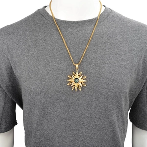 Mens gold sunburst starburst pendant with compass on a gold curb chain necklace