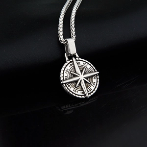 Vintage silver compass necklace with engraved round pendant and sleek twist chain for men