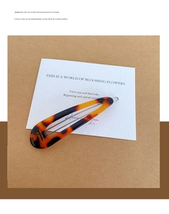 Detail showing France Handmade engraving on classic tortoiseshell water drop hair clip