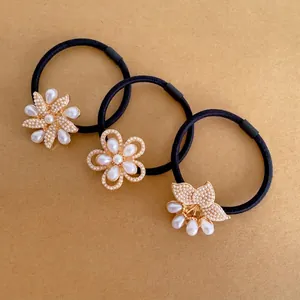 Three-piece black high-elastic hair ties set with golden pearl flower and bow accents