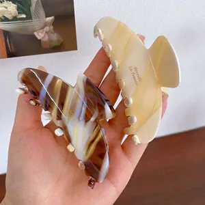 Pinces à cheveux papillon élégantes en acétate écaille de tortue et crème dorée