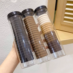 Three-pack tube set of durable high-elastic hair ties in neutral earth tones for women