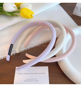 Detail of colorful sponge headbands in pastel purple, beige, pink and blue tones