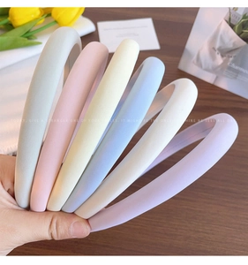 Close-up of Morandi colored fabric padded headbands with a premium soft matte texture