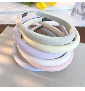 Detailed view of handmade thick sponge headbands in six soft macaron colors