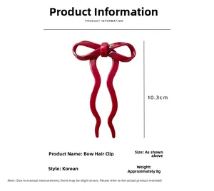 Detail showing red bow hair pin with U-shaped design and 10.3cm measurement display