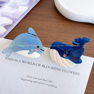 Chic ocean theme acetate hair clips featuring blue dolphin and whale marble patterns