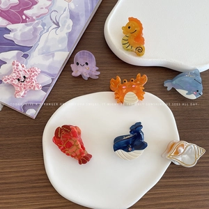 Exquisite acetate marine animal hair claws set including dolphin and starfish shapes