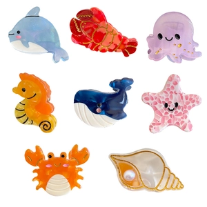 8-piece set of ocean-themed acetate hair claws featuring colorful dolphin and starfish shapes