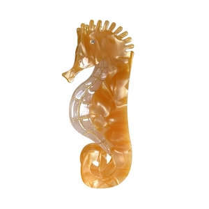 Pince à cheveux hippocampe en acétate ambré avec texture marbrée et détails dorés