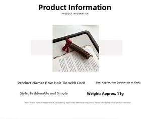 Close-up of brown spiral hair tie with red bow detail showing 8cm stretchable size