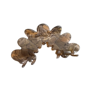 Elegant amber flower petal hair claw clip with wood grain texture for long hair