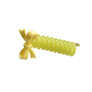 Yellow spiral phone line hair tie with a handmade acetate bow accessory for women