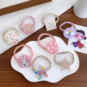 Set of 7 colorful acrylic hair ties for kids featuring flowers and star patterns