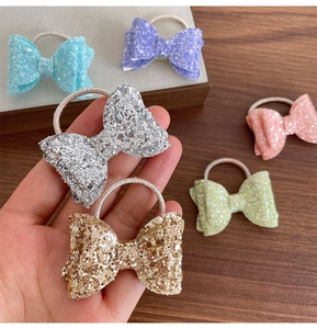Détail de nœuds papillon à paillettes pour enfants en diverses couleurs pastel