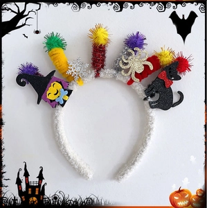 Close-up of Halloween headband with plush colorful balls and miniature witch characters