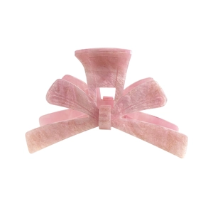 Pink acetate bow hair claw clip with marble texture and golden glitter for women