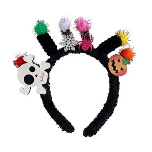 Halloween headband for girls with sequined skull, orange pumpkin, and colorful pompoms