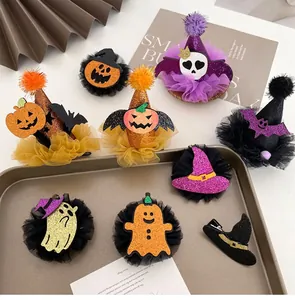 Close-up of Halloween hair clips with pumpkin, ghost, and bat shapes in mesh and sequins