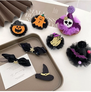 Detailed close-up of Halloween hair clips with sequins, mesh lace, and festive motifs