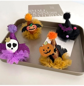 Set of four mini Halloween hats with mesh trim, glitter fabric, and festive charms