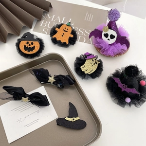 Kids Halloween hair clip set with pumpkin, bat, and witch hat motifs in glitter and mesh