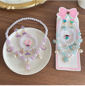 Kids ocean jewelry set featuring pearl beads with starfish and shell charms