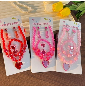 Detailed set of children gemstone heart crown jewelry in red and pink variations