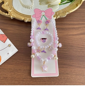 Kids mermaid jewelry set with pearls and starfish charms on a white display card
