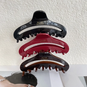Three-piece French acetate claw clip set in black, wine red, and coffee brown with gold text