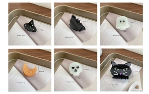 Detailed views of Halloween acetate hair clips showing sizes of cat, bat and ghost designs
