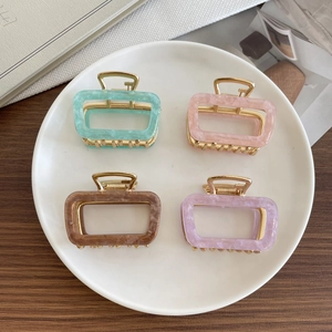 Set of four colorful acetate square hair claws with premium gold-toned metal frames