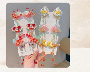 Exquisite Hanfu hair clip detail with pink flowers, tassels, and pearl beads charms