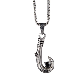 Vintage hook pendant necklace with black gemstone and intricate tribal carvings