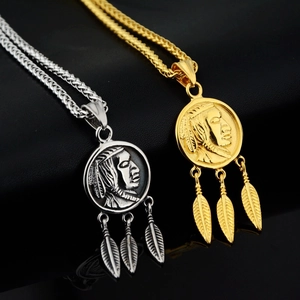 Close-up of gold and silver Indian chief pendants with feathers on wheat chains