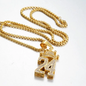 Hip hop crown 24 iced out necklace with gold square chain on a grey background