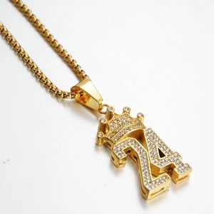 Detailed close-up of hip-hop number 24 crown pendant with sparkling crystals and gold finish