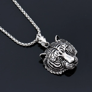 Hip hop tiger head pendant necklace in stainless steel with a vintage finish and box chain