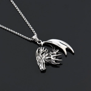 Detailed close-up of a silver gothic dragon head pendant with punk style scales