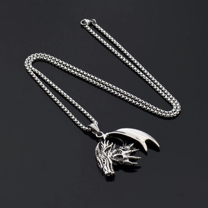 Hip hop titanium steel dragon pendant necklace with box chain on black reflective surface