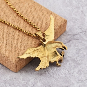 Hip hop style gold falcon eagle pendant necklace with detailed feathers on a chain