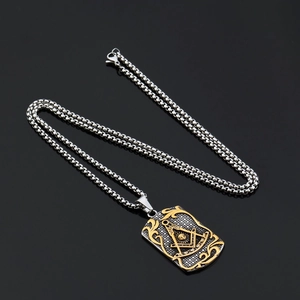 Two-tone Freemason pendant necklace in silver and gold with intricate box chain detail