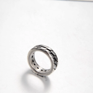Retro stainless steel men's ring featuring black woven texture and hollow design