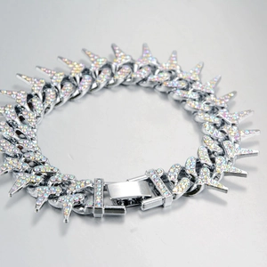 Macro shot of silver hip hop thorn link bracelet with iridescent zircon micro-paving detail