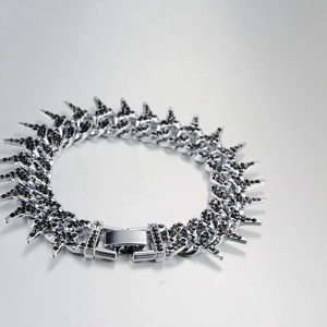 Macro detail of punk thorn chain bracelet with micro-paved black cubic zirconia stones