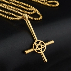 Detail of gold-plated inverted cross and pentagram pendant on a black box chain