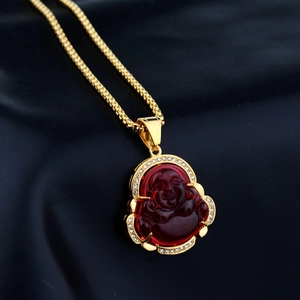 Golden Maitreya Buddha necklace with red resin pendant and sparkling zircon frame