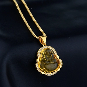 Macro detail of Maitreya Buddha pendant with golden frame and sparkling zircon inlay