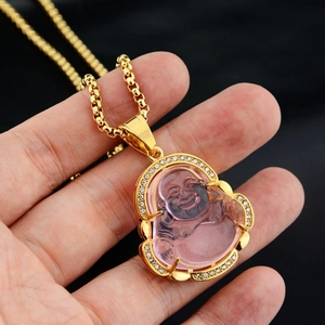 Macro view of pink crystal Maitreya Buddha pendant with sparkling diamond bezel detail